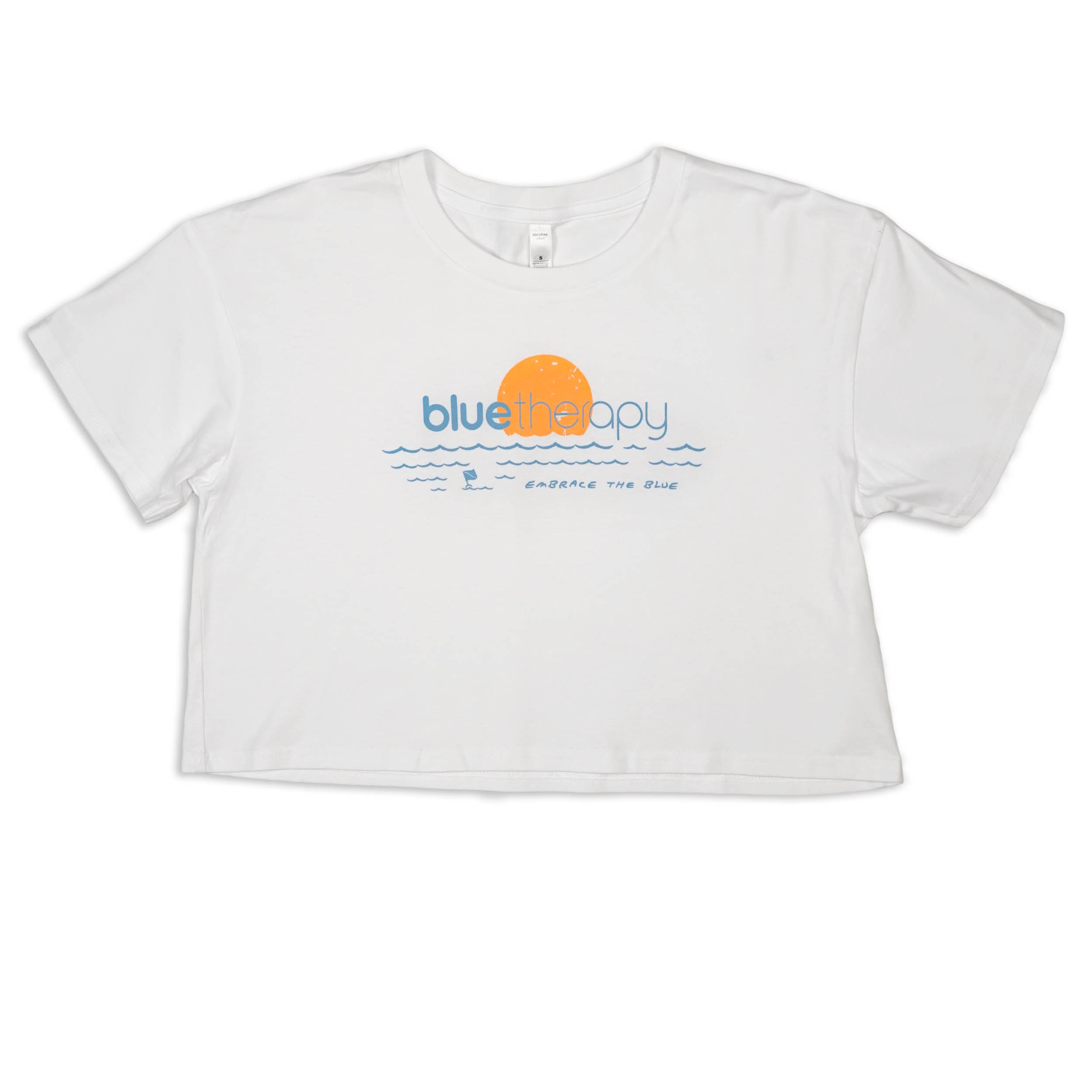 BlueTherapy white crop tee with blue and orange 'Embrace The Blue' text and art design on the front.