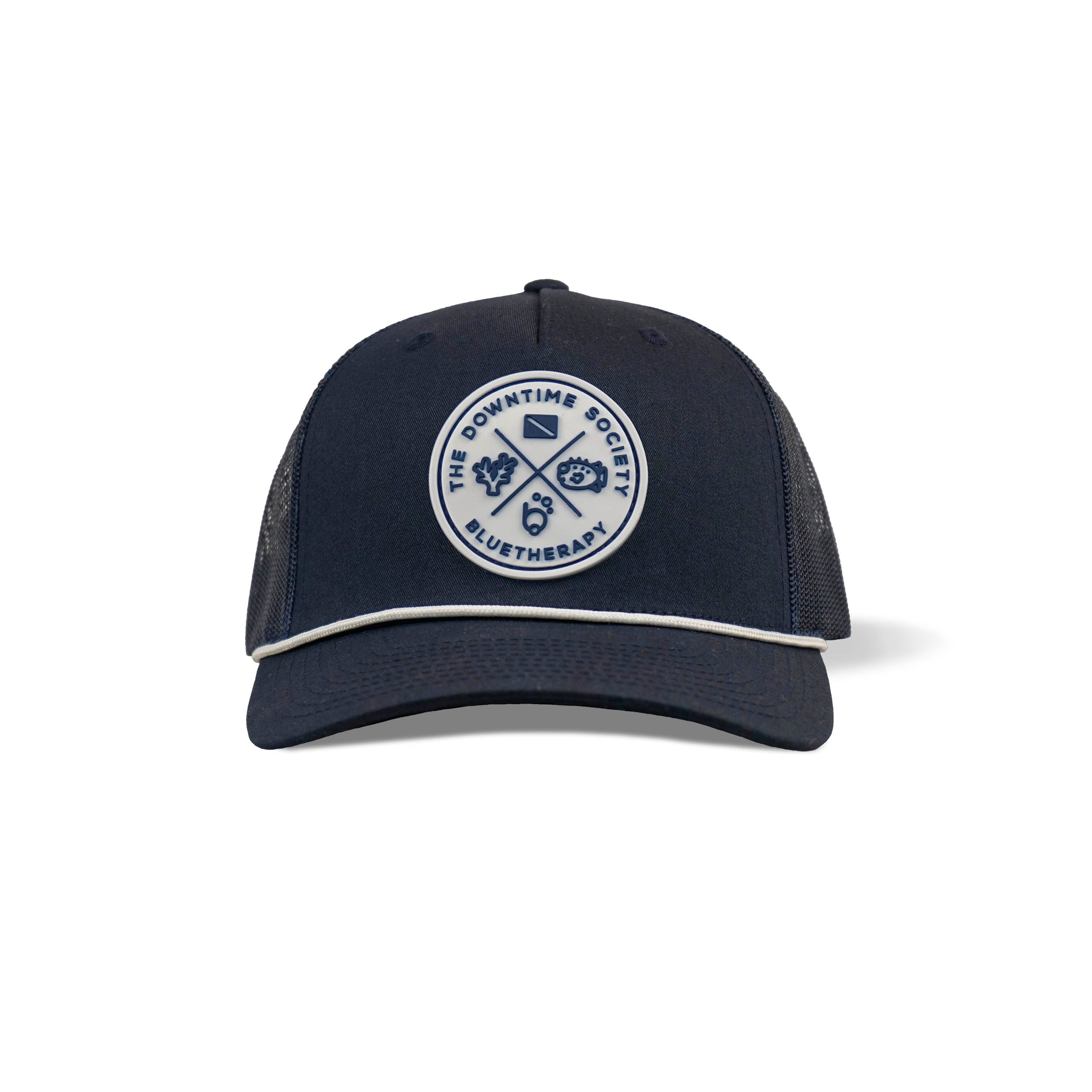Front view of BlueTherapy Downtime Society rope trucker hat in navy, white embossed vinyl circular patch stitched and glued with crossed elements (dive flag, leaves, pufferfish, etc.), rope detail on brim